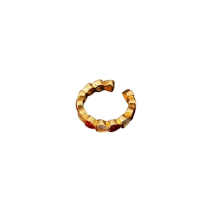 Vintage style gold open ring featuring alternating red and white heart charms on the band