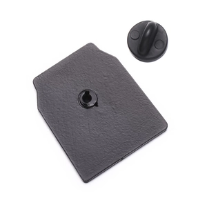 Detail view of the black rubber clutch and metal pin back for enamel badges