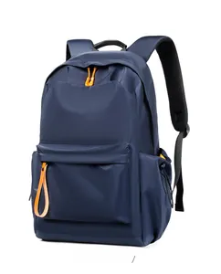 Detail of waterproof navy blue backpack with orange zipper pulls and breathable straps