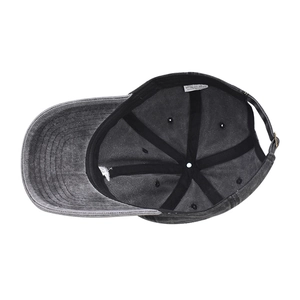 Detail of washed cotton baseball cap showing reinforced inner seams and 100% cotton label