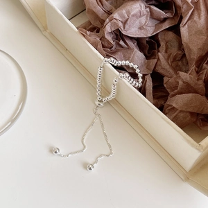 Detail of S925 sterling silver beaded ring with adjustable drawstring design on box