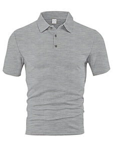 Close-up of light grey waffle knit fabric texture on men's short sleeve polo shirt
