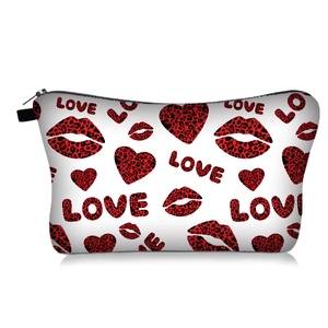 Detail view of heart and leopard print makeup bag with silver metal zipper and black pull