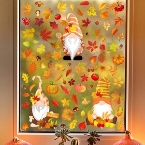 Thanksgiving window stickers featuring gnomes, maple leaves and pumpkins on glass
