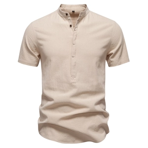 Close-up of beige cotton linen men shirt with mandarin collar and button placket detail