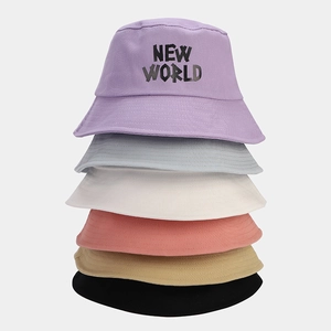 Multiple colors of cotton bucket hats with NEW WORLD embroidery shown in a vertical stack