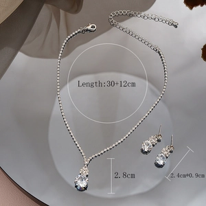 Detailed view of cubic zirconia necklace and earring set with size dimensions and mirror base