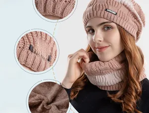 Detail of winter knitted beanie and neck warmer set with thick plush lining and logo