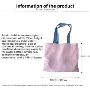 Detail view of pink seersucker tote bag with blue handles and internal pocket structure