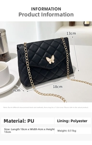 Detailed view of black quilted crossbody bag with white butterfly buckle and gold chain