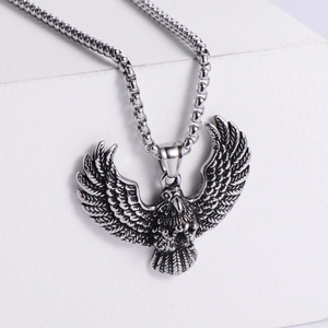 Retro eagle pendant necklace in polished stainless steel with intricate wing detail