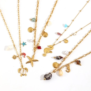 Gold ocean necklaces with starfish and shell pendants on elegant paperclip chains