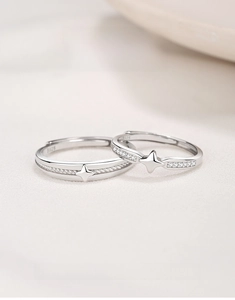 Macro view of S925 sterling silver couple rings showing starlight engraving and s925 stamp