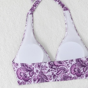 Detail view of paisley bikini top featuring padded cups and breathable mesh lining