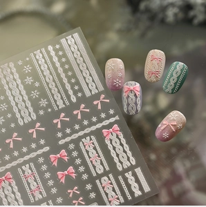 Detailed 3D embossed nail stickers featuring sweater textures and pink bow designs