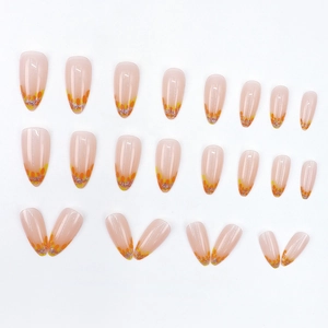 Autumn almond press-on nails with orange yellow leaf gradient and silver glitter accents