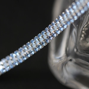 Three-row silver chain bracelet with mermaid blue crystals and secure claw setting
