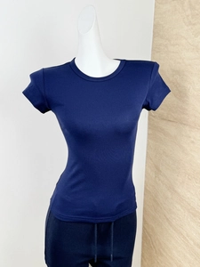 Detail of dark blue slim fit T-shirt showing ribbed texture and crew neck design