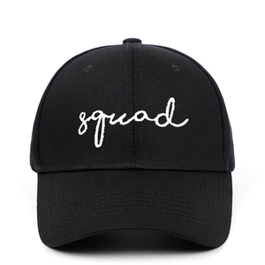 Black cotton baseball cap featuring white squad embroidery in a minimalist outdoor style