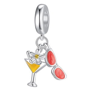 Silver bead charm with yellow cocktail glass, small flower and red sunglasses charms