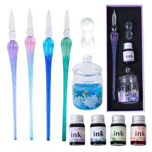 Gradient glass dip pen set with four colorful pens, five inks, and a floral cleaning cup