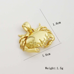 Macro detail of a 1.6cm golden crab pendant showing refined texture and 1.5g weight