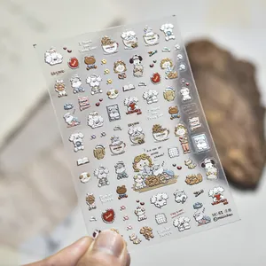 Close-up of embossed nail art sticker featuring cute hand-drawn cartoon puppy designs