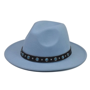 Detail of light blue wool fedora featuring turquoise stone chain and silver rivets