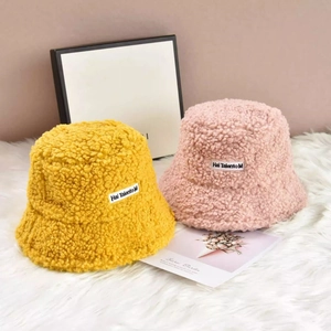 Thick warm teddy fleece bucket hats in yellow and pink for women's winter fashion wear