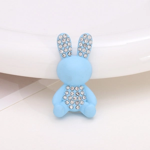 Macro view of a blue rabbit charm with sparkling rhinestones for shoe decoration