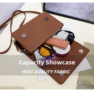 Interior view showing the large capacity of the brown crossbody bag for daily items