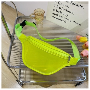 Detail view of neon yellow transparent PVC fanny pack with black buckle on metal trolley
