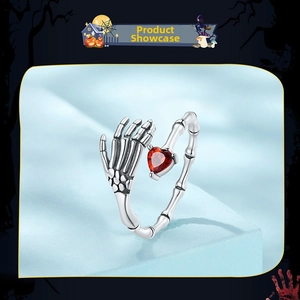 Detailed shot of S925 silver skeleton hand ring with a red heart-shaped zircon stone
