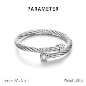 Macro shot of silver twisted cable stainless steel bangle with dimensions 59x6mm