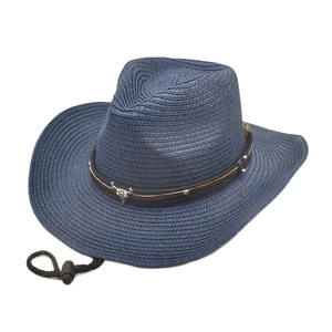 Detailed view of navy straw cowboy hat with brown leather band and silver bull skull ornament