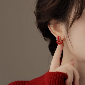 Elegant gold C-shaped hoop earrings featuring red crystal beads and micro zircon accents