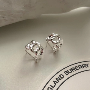 Detail shot showing the polished texture of 925 sterling silver chain link earrings