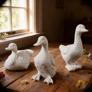 Detailed texture of three resin duck figurines on a wooden table with natural sunlight