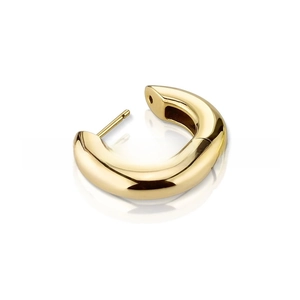 Detail shot of chunky gold C-shaped hoop earrings with polished mirror finish surface
