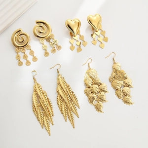Detailed view of four pairs of 18k gold plated stainless steel leaf tassel earrings