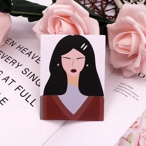 Detail of elegant earring display card featuring a minimalist female illustration and roses