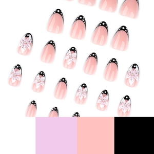 Faux ongles français avec pois noirs et accents floraux 3D en rose et noir élégant