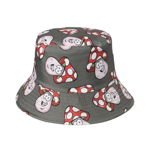 Detail view of the grey bucket hat featuring cute cartoon mushroom patterns and stitching