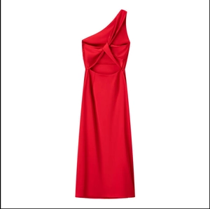 Detail of red one-shoulder satin dress featuring asymmetrical cutout design and silky texture