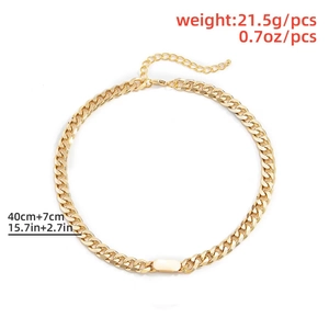 Detail of gold Cuban link chain with rectangular pendant and adjustable lobster clasp