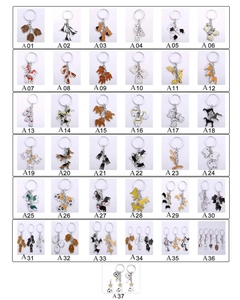 Grid layout showing various metal dog-themed keychains with unique identification codes