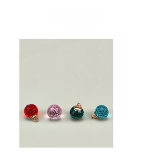 Detail showing 10mm faceted glass buttons in red pink green and blue with gold loops