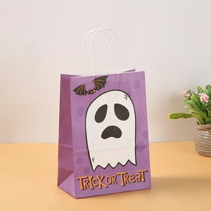 Detail of purple Halloween gift bag with ghost and bat prints on kraft paper