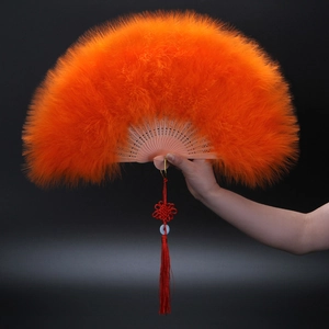 Thick orange feather fan with hollow wooden ribs and red Chinese knot tassel pendant
