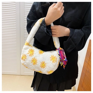 Close-up of white plush flower tote bag with yellow daisy pattern and silk scarf detail